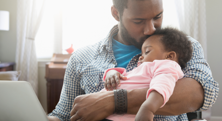 father holding baby daughter