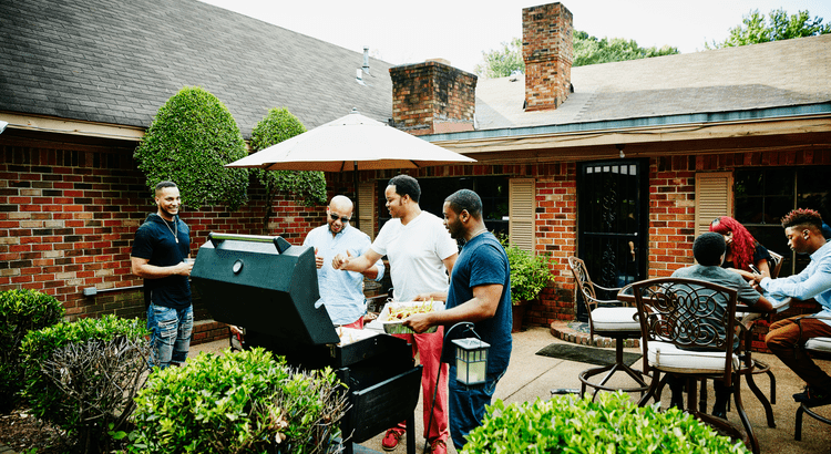 Multi-generational family enjoying a barbecue at home